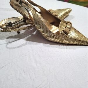 Gold PRADA sling-back pumps